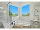 Bright bathroom featuring a walk-in shower and soaking tub with a backyard view at 2027 Cedar Falls Dr # 75, Waxhaw, NC 28173