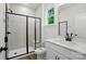 Bathroom with modern shower, black hardware, and white vanity at 2027 Cedar Falls Dr # 75, Waxhaw, NC 28173