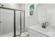 Modern bathroom features a black-framed glass shower, tile, and a stylish vanity at 2027 Cedar Falls Dr # 75, Waxhaw, NC 28173