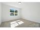 Bright bedroom with large window offering pleasant views and neutral carpeting at 2027 Cedar Falls Dr # 75, Waxhaw, NC 28173