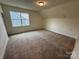 Neutral bedroom featuring carpet flooring and single window at 2027 Cedar Falls Dr # 75, Waxhaw, NC 28173