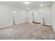 Spacious bedroom with neutral carpet, white walls, and access to multiple rooms at 2027 Cedar Falls Dr # 75, Waxhaw, NC 28173