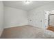 Bedroom with neutral carpet, two closets, and an ensuite bathroom at 2027 Cedar Falls Dr # 75, Waxhaw, NC 28173