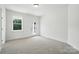 Bedroom featuring neutral carpet and a door to the backyard at 2027 Cedar Falls Dr # 75, Waxhaw, NC 28173