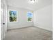 Spacious bedroom with neutral carpet and bright windows with backyard views at 2027 Cedar Falls Dr # 75, Waxhaw, NC 28173