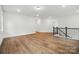 Bonus room with hardwood floors and neutral walls at 2027 Cedar Falls Dr # 75, Waxhaw, NC 28173