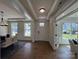 Inviting entryway with wood floors, white trim, and a view into the dining area at 2027 Cedar Falls Dr # 75, Waxhaw, NC 28173