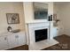 Living area features a modern fireplace with marble surround and built-in shelving at 2027 Cedar Falls Dr # 75, Waxhaw, NC 28173