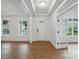 Open foyer with coffered ceilings, white wainscoting, and hardwood flooring at 2027 Cedar Falls Dr # 75, Waxhaw, NC 28173