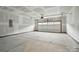 Spacious two-car garage with ample room for parking and storage; unfinished drywall at 2027 Cedar Falls Dr # 75, Waxhaw, NC 28173