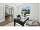 Spacious home office featuring natural light and an open view of the dining room and living spaces at 2027 Cedar Falls Dr # 75, Waxhaw, NC 28173