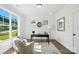 Bright home office with large windows, a modern desk, and comfortable seating at 2027 Cedar Falls Dr # 75, Waxhaw, NC 28173