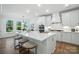 Spacious kitchen features a center island with seating, modern appliances, and ample counter space at 2027 Cedar Falls Dr # 75, Waxhaw, NC 28173