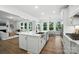 Bright open kitchen with large island, stainless steel sink, and seamless flow to living spaces at 2027 Cedar Falls Dr # 75, Waxhaw, NC 28173