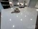 Expansive kitchen island with white quartz countertop, seating, and stylish decor, great for casual dining at 2027 Cedar Falls Dr # 75, Waxhaw, NC 28173