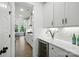 Contemporary kitchen with stainless steel wine fridge, custom cabinets and a view to the dining area at 2027 Cedar Falls Dr # 75, Waxhaw, NC 28173