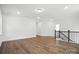 Large living room features hardwood floors and a stairway at 2027 Cedar Falls Dr # 75, Waxhaw, NC 28173