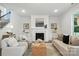 Bright living room showcasing a fireplace, built-ins, and stylish decor elements at 2027 Cedar Falls Dr # 75, Waxhaw, NC 28173