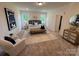 Inviting main bedroom with a plush bed, elegant decor, and soft natural light, for a relaxing retreat at 2027 Cedar Falls Dr # 75, Waxhaw, NC 28173
