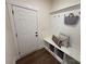 Cozy mudroom boasts built-in bench with storage and hooks for organization at 2027 Cedar Falls Dr # 75, Waxhaw, NC 28173