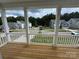 Neighborhood view from the porch featuring new construction homes and wooded view at 2027 Cedar Falls Dr # 75, Waxhaw, NC 28173