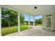 Covered patio with white columns overlooking a well-maintained backyard and an outdoor fire pit at 2027 Cedar Falls Dr # 75, Waxhaw, NC 28173
