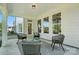 Relaxing covered patio area with stylish seating and ample natural light at 2027 Cedar Falls Dr # 75, Waxhaw, NC 28173