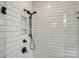 Modern bathroom shower with white subway tile and matte black shower fixtures at 2027 Cedar Falls Dr # 75, Waxhaw, NC 28173