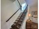 Elegant staircase with dark wood railings and spindles leading upstairs at 2027 Cedar Falls Dr # 75, Waxhaw, NC 28173