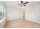 Bright bedroom with a ceiling fan, light-colored walls, and wood-look flooring at 1011 Indiana St, Kannapolis, NC 28083