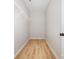 Walk-in closet with built-in shelving and wood-look flooring at 1011 Indiana St, Kannapolis, NC 28083