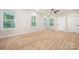 Bright living room with wood floors, large windows, and natural light at 1011 Indiana St, Kannapolis, NC 28083