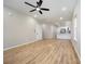 Open-concept living area with wood flooring and new ceiling fan, perfect for entertaining at 1011 Indiana St, Kannapolis, NC 28083