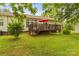 A well-maintained yard, spacious deck, and mature trees create a peaceful outdoor retreat at 3951 Springs Rd, Conover, NC 28613