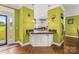 Kitchen bar area with breakfast bar seating and herringbone hardwood flooring at 3951 Springs Rd, Conover, NC 28613