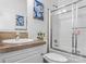Bathroom featuring a shower with glass doors, tile accents, and a modern vanity at 3951 Springs Rd, Conover, NC 28613