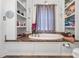 Luxurious bathroom featuring a soaking tub, built-in shelving, and stylish decor at 3951 Springs Rd, Conover, NC 28613