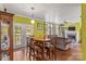 Open concept floor plan featuring dining table, french doors, and a cozy living room at 3951 Springs Rd, Conover, NC 28613
