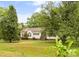 Charming single-story home with mature landscaping and a lush green lawn at 3951 Springs Rd, Conover, NC 28613