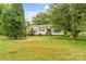 Charming single-story home with mature landscaping and a lush green lawn at 3951 Springs Rd, Conover, NC 28613
