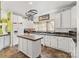 Bright kitchen with an island, white cabinetry, contrasting countertops and modern appliances at 3951 Springs Rd, Conover, NC 28613