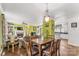 Open-concept living and dining area featuring hardwood floors, a fireplace, and abundant natural light at 3951 Springs Rd, Conover, NC 28613
