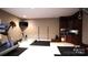 Basement workout area with modern equipment, cabinetry, and ample space for fitness activities at 6620 Old Concord Rd, Salisbury, NC 28146