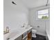 Updated bathroom with a double vanity, dark floors, and modern fixtures at 6620 Old Concord Rd, Salisbury, NC 28146