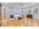 Spacious bedroom with hardwood floors, plantation shutters, and soft blue walls at 6620 Old Concord Rd, Salisbury, NC 28146