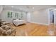 Large bedroom with hardwood floors, three windows and light gray walls and white ceiling at 6620 Old Concord Rd, Salisbury, NC 28146