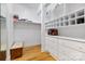 Walk-in closet with built-in storage and hardwood floors, and white walls at 6620 Old Concord Rd, Salisbury, NC 28146