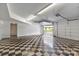 Spacious garage with checkered flooring and an open door to the driveway at 6620 Old Concord Rd, Salisbury, NC 28146