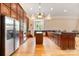 Large kitchen has stainless appliances, dark wood cabinets, and island at 6620 Old Concord Rd, Salisbury, NC 28146