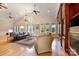Open living room with fireplace, wood floors, and many windows at 6620 Old Concord Rd, Salisbury, NC 28146